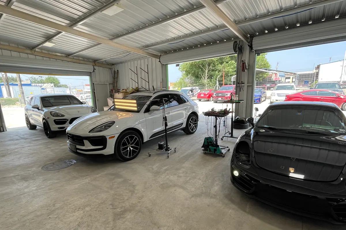 Porsche and Ferrari vehicles in the 5Star repair bay
