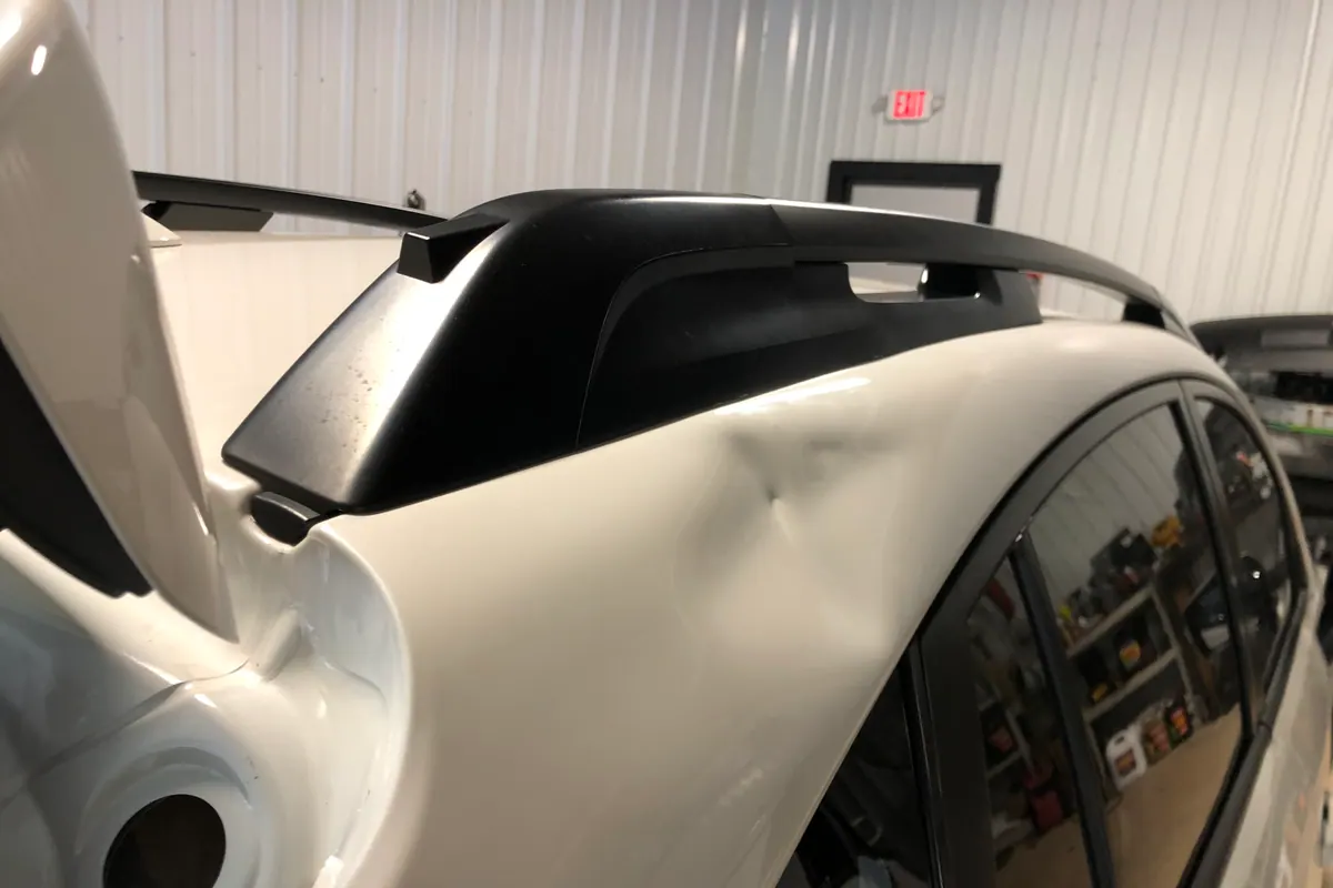 Vehicle opened for interior panel access during repair