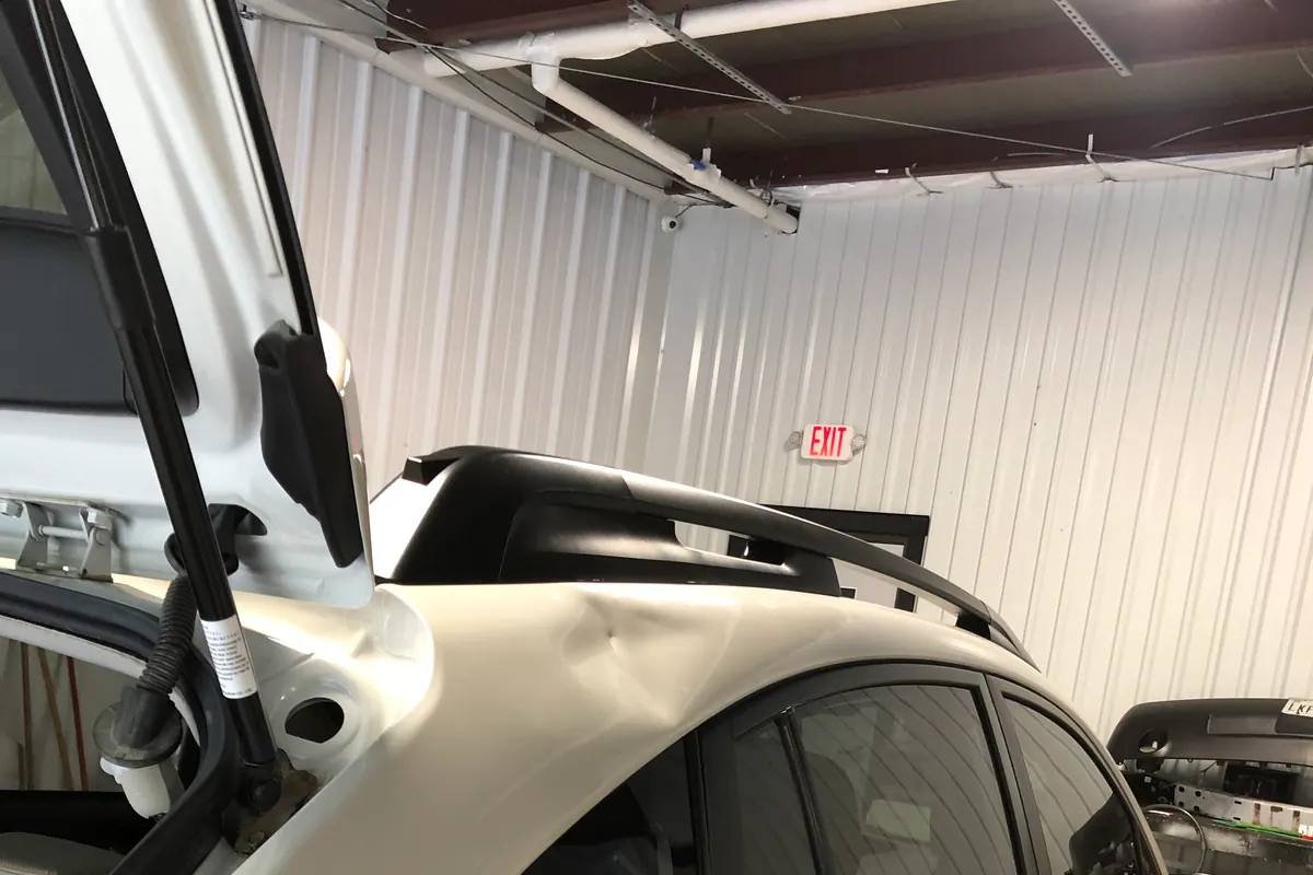 Second view of vehicle panel access during repair