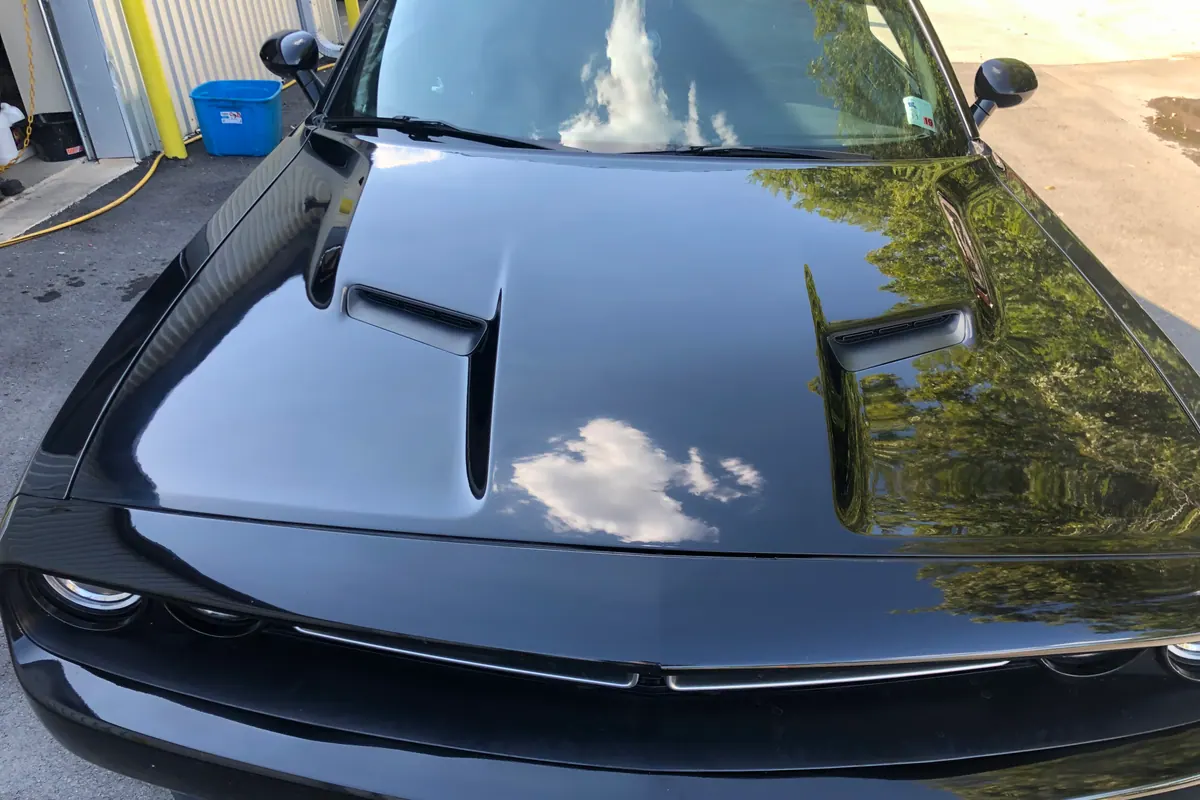 Dark blue performance vehicle after panel repair
