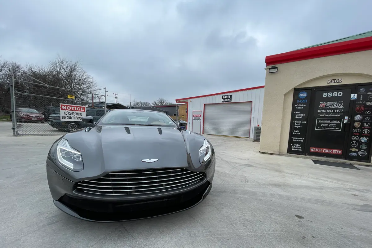 Gray Aston Martin after body panel service